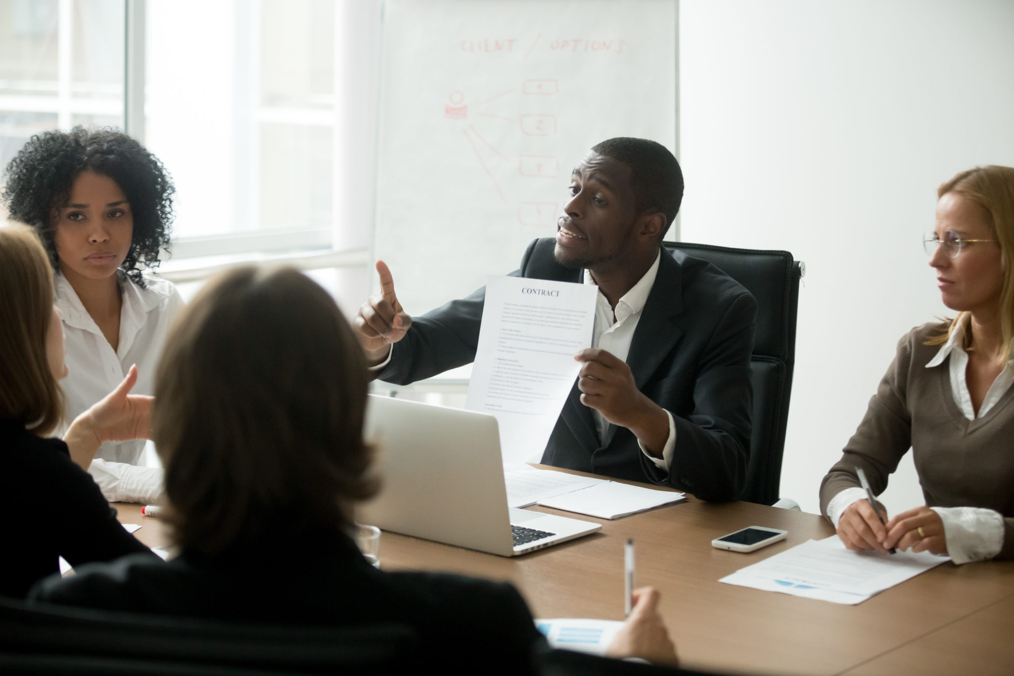 African-american businessman disagreeing with contract terms at