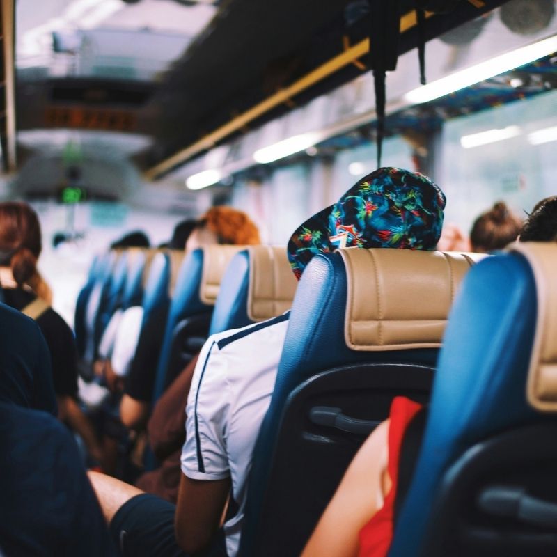 Bus interior with passengers seated