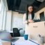 Employee packing a box at her desk