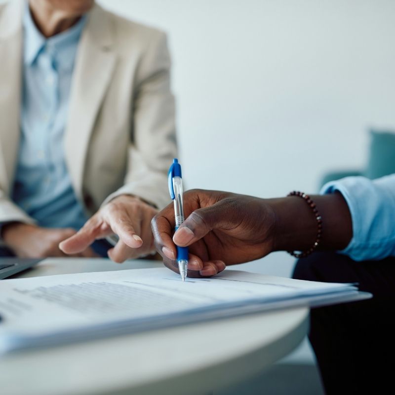 Hand completing a Road Accident Fund claim form